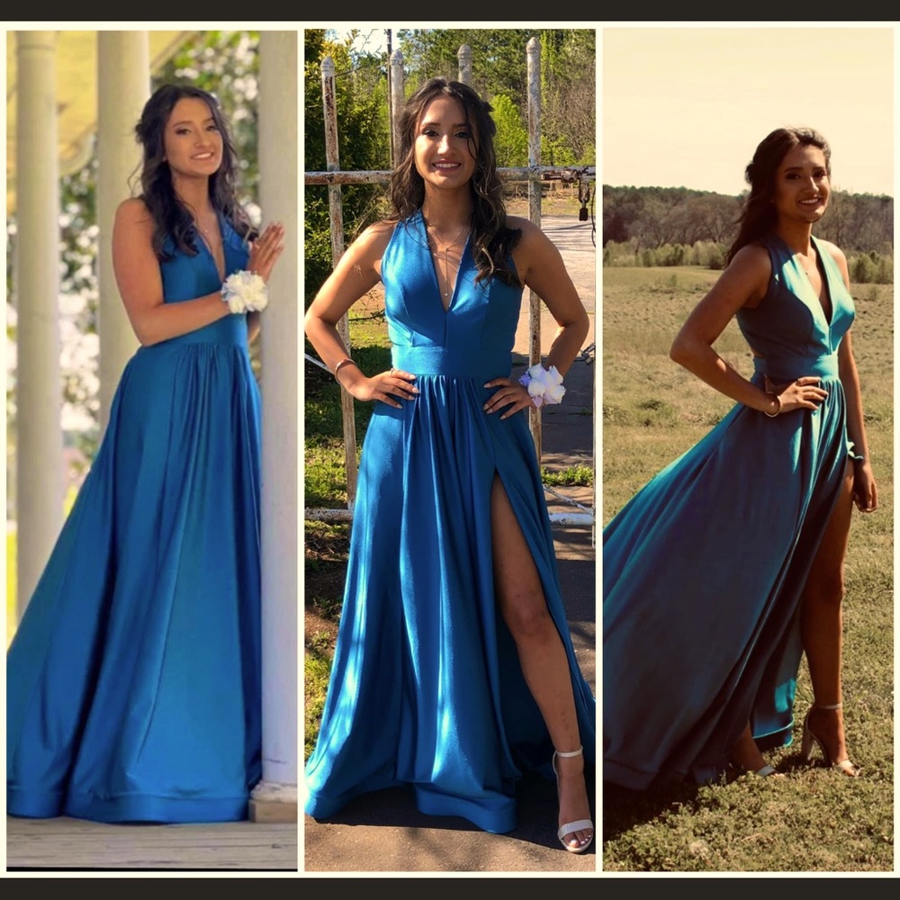 Blue dress with slit, down the leg and a low V-neck